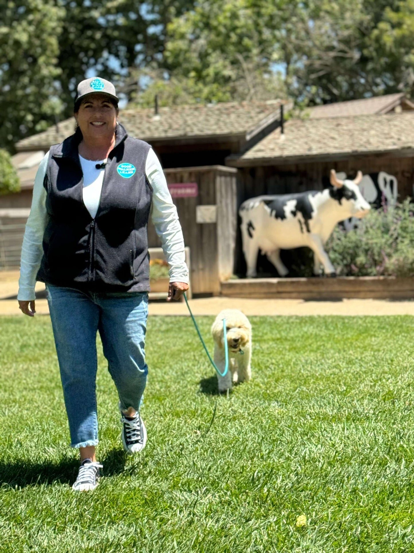 Woman and dog with long line leash 