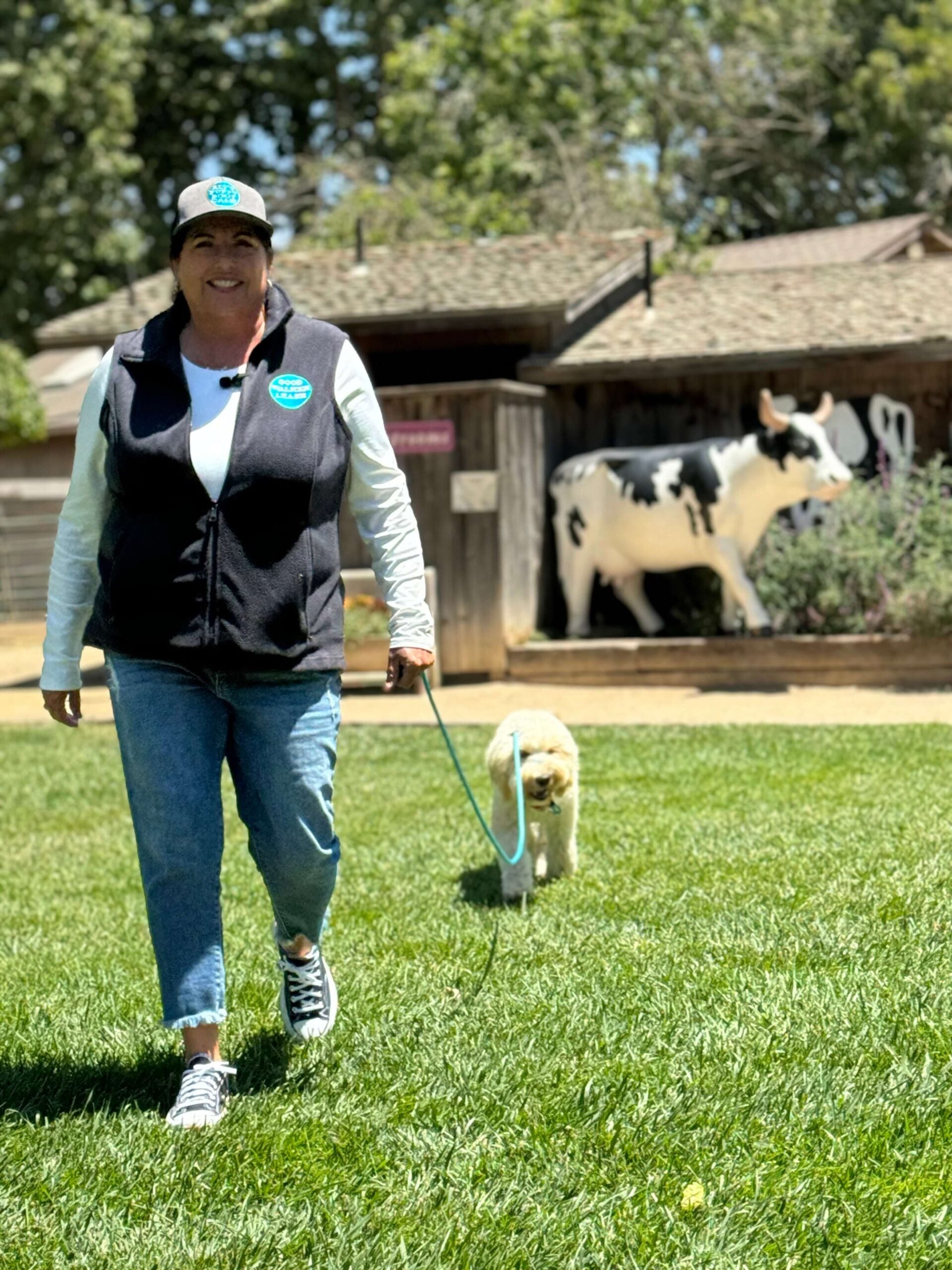 Woman and dog with long line leash 