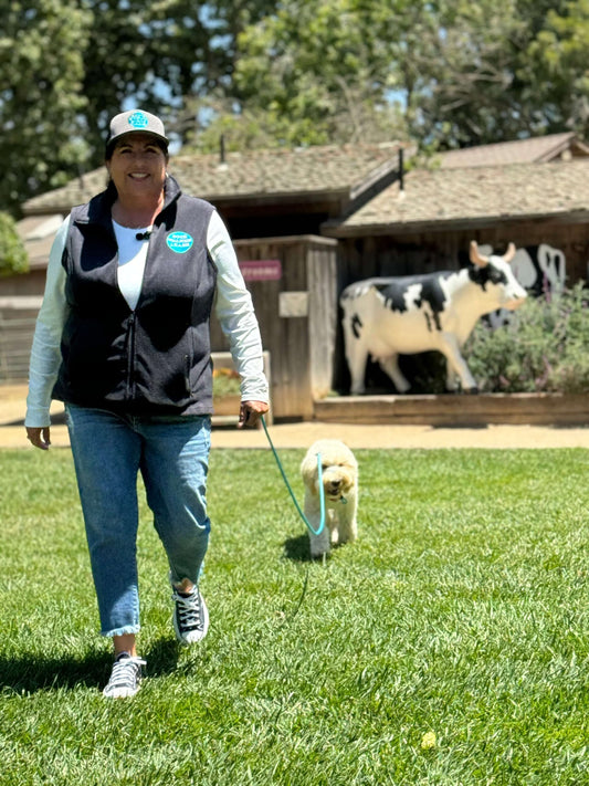 Woman and dog with long line leash 